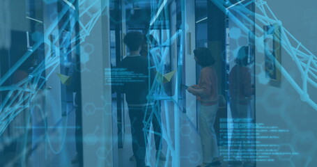 Collaborating three coworkers on digital screen in glass corridor, with cyan network graphics