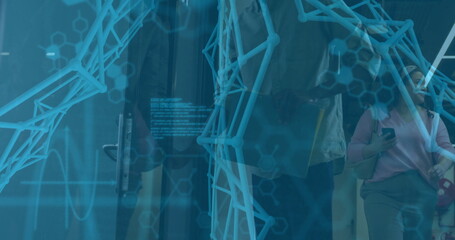 Two colleagues pausing and walking through facility hallway, with card reader and network overlay