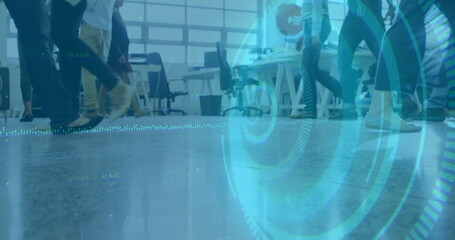 Moving workers' legs crossing open-plan office, with furniture, grid-style windows and blue overlay