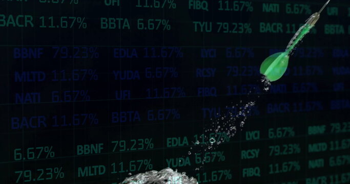 Piercing bright green dart hitting water making large splash on finance screen, with stock tickers