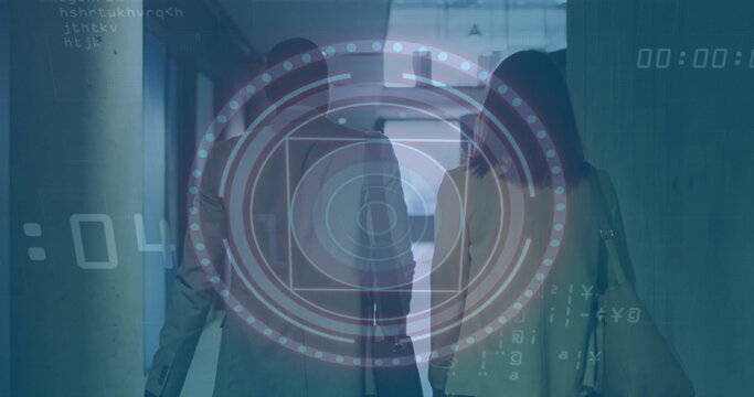 Walking duo wearing jackets carrying briefcase and shoulder bag through corridor under HUD overlay - Powered by Adobe