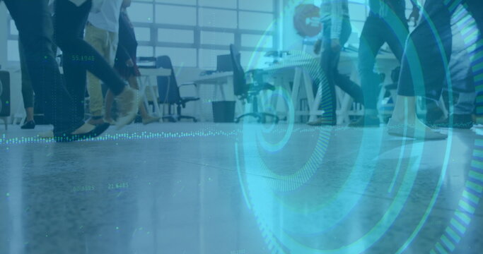 Moving workers' legs crossing open-plan office, with furniture, grid-style windows and blue overlay