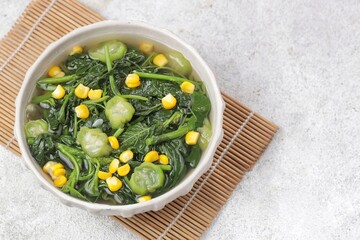 Sayur bayam bening or spinach clear soup in bowl