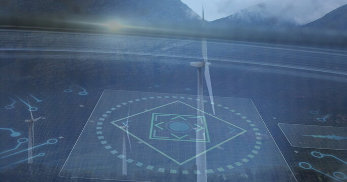 Displaying wind turbine rotating in foggy valley with holographic grid overlay and floating panels