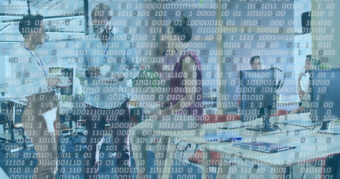 Collaborating team reviewing project in open-plan office, with laptops and binary code - Powered by Adobe