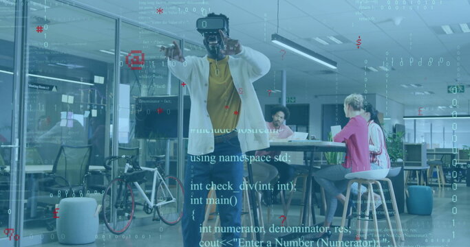 Reaching man wearing virtual reality headset exploring digital content at office, bicycle behind