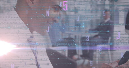 Businessman in suit checking smartphone in conference room, with laptops, notebooks, code overlay