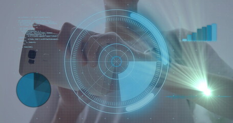 Man in shirt holding smartphone interacting with holographic display in studio with data overlays