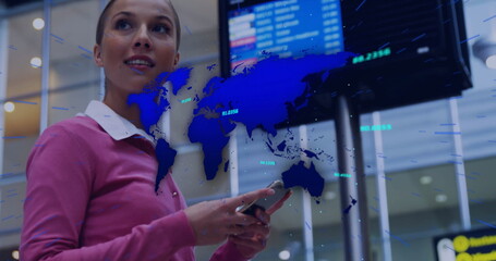 Holding smartphone traveler scanning airport terminal display, with world map overlay copy space