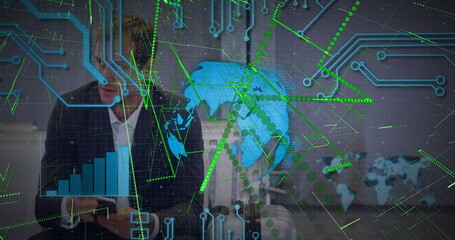 Analyzing digital globe and bar charts executive wearing suit holding tablet in office, copy space