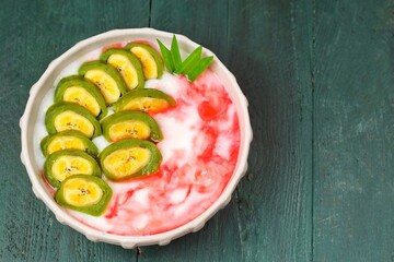 Es Pisang Ijo. Green banana ice is a type of typical food from the Makassar tribe in South Sulawesi. This food is made from bananas coated with green flour dough