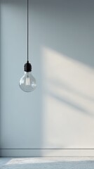 Minimalist Hanging Light Bulb in Modern Interior