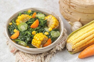 Sayur bayam bening or spinach clear soup in bowl