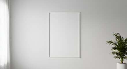 Minimalist interior concept with a blank vertical frame mockup on a white wall, next to a green plant and window light.