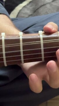 playing rabab musical instrument