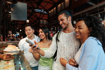 Tourists photographing food in Barcelona's Boqueria market
