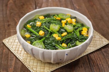 Sayur bayam bening or spinach clear soup in bowl