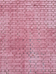 Brick wall painted pink white paint
