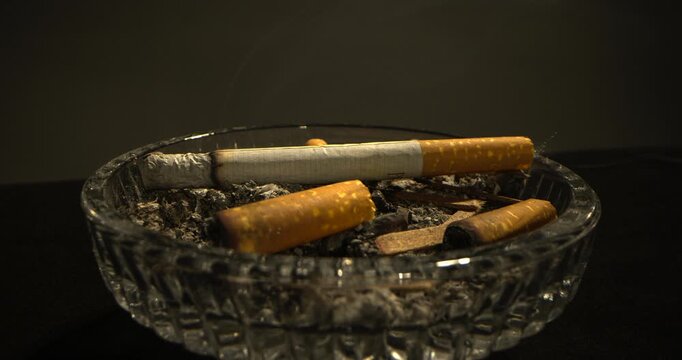 Cigarette Burning in Ash Tray Time Lapse