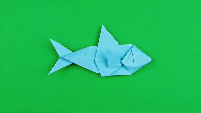 Origami Shark on Green Background: Paper Crafting.