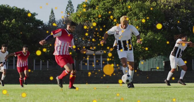 Soccer player dribbling ball evading sliding tackle keeping ball stumbling releasing ball for chase