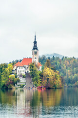 The magical atmosphere of Lake Bled in autumn. Among boats and mystical charm. Slovenia