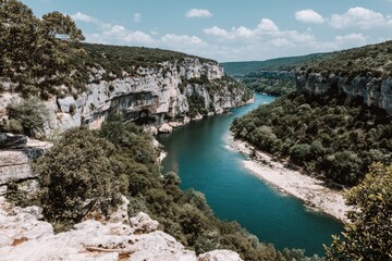 Obraz premium River winding through a dramatic canyon