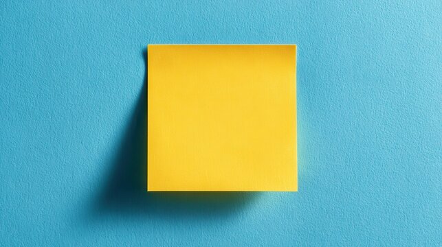 A 4K photo of bright yellow sticky note square on smooth blue background for reminders notes or organizational planning with minimal style and flat lay perspective.