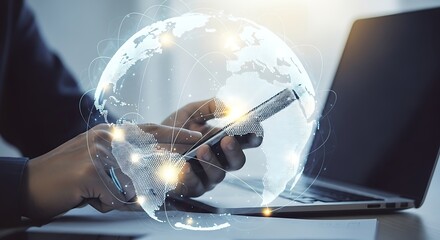 Hands using smartphone with global network overlay and laptop