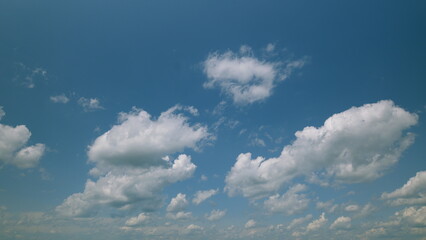 Time lapse. A Beautiful Blue Sky Adorned with Fluffy White Clouds on a Bright and Sunny Clear Day