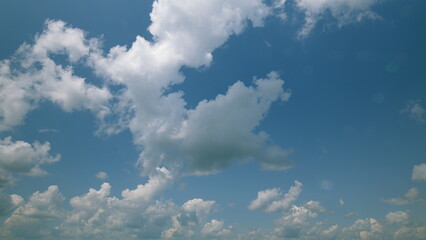 Time lapse. A Beautiful Sky is adorned with Fluffy Clouds on a Perfectly Clear and Bright Day outside