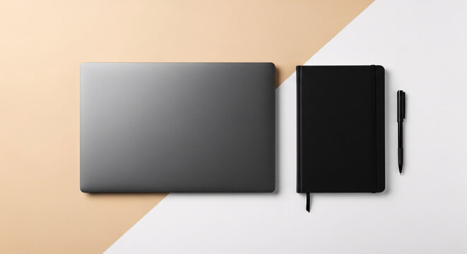 Minimalist top view flat lay of a closed laptop, black notebook, and pen. Modern workspace on a two-tone background for business, remote work, or creative projects. Organized and stylish desk