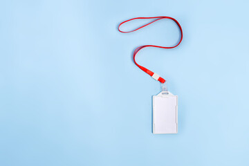 Empty Plastic Name Badge Holder With Strap Isolated On Blue Surface