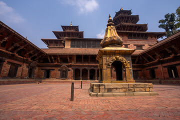 Old courtyard of Patan Durbar Palace as a peaceful place in Kathmandu, Nepal.
