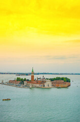 Naklejka premium Venice aerial view of the island with church of San Giorgio Maggiore, view from the Bell Tower (Campanile di San Marco), in Venice, Italy, at sunrise