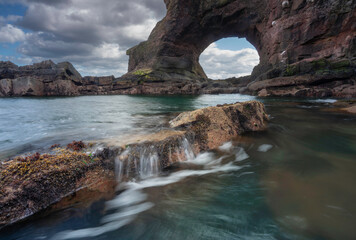 Auchmithie rock arch located on the Angus coastline of Scotland.