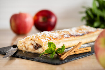 Homemade apple strudel on wooden table