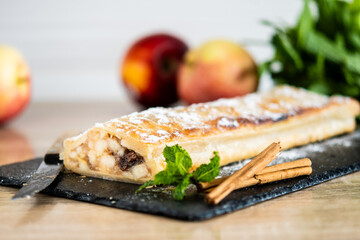 Homemade apple strudel on wooden table