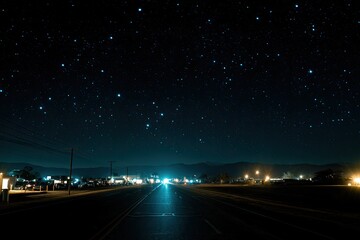 Starry night road through town