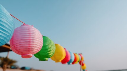 Colorful lanterns illuminate festive celebration beachside photography clear sky close-up cultural tradition