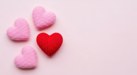 Obraz premium Knitted red heart and pink decoration flat lay for valentines day background