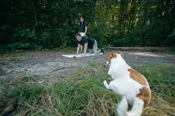 Adult couple relax at nature near lake at summer
