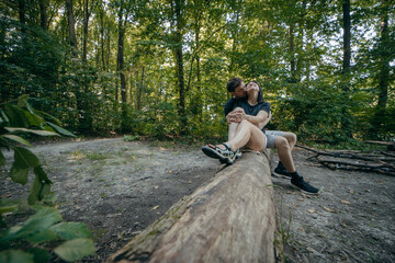 Adult couple relax at nature near lake at summer