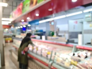 Defocused frozen food section in a supermarket