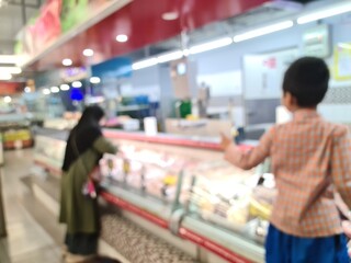 Defocused frozen food section in a supermarket