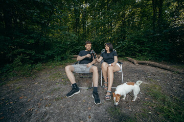 Adult couple relax at nature near lake at summer