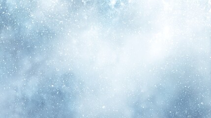 Light snowfall creates a serene winter atmosphere in a quiet forest setting during the early morning hours