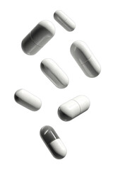 Several white and gray pills in mid-air