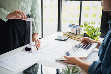 Solar panels green energy Business people working in green eco friendly office business meeting creative ideas for business eco friendly professional teaching corporate people sustainable electricity