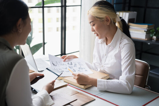 Interior designers brainstorming creative furniture design ideas in collaborative meeting